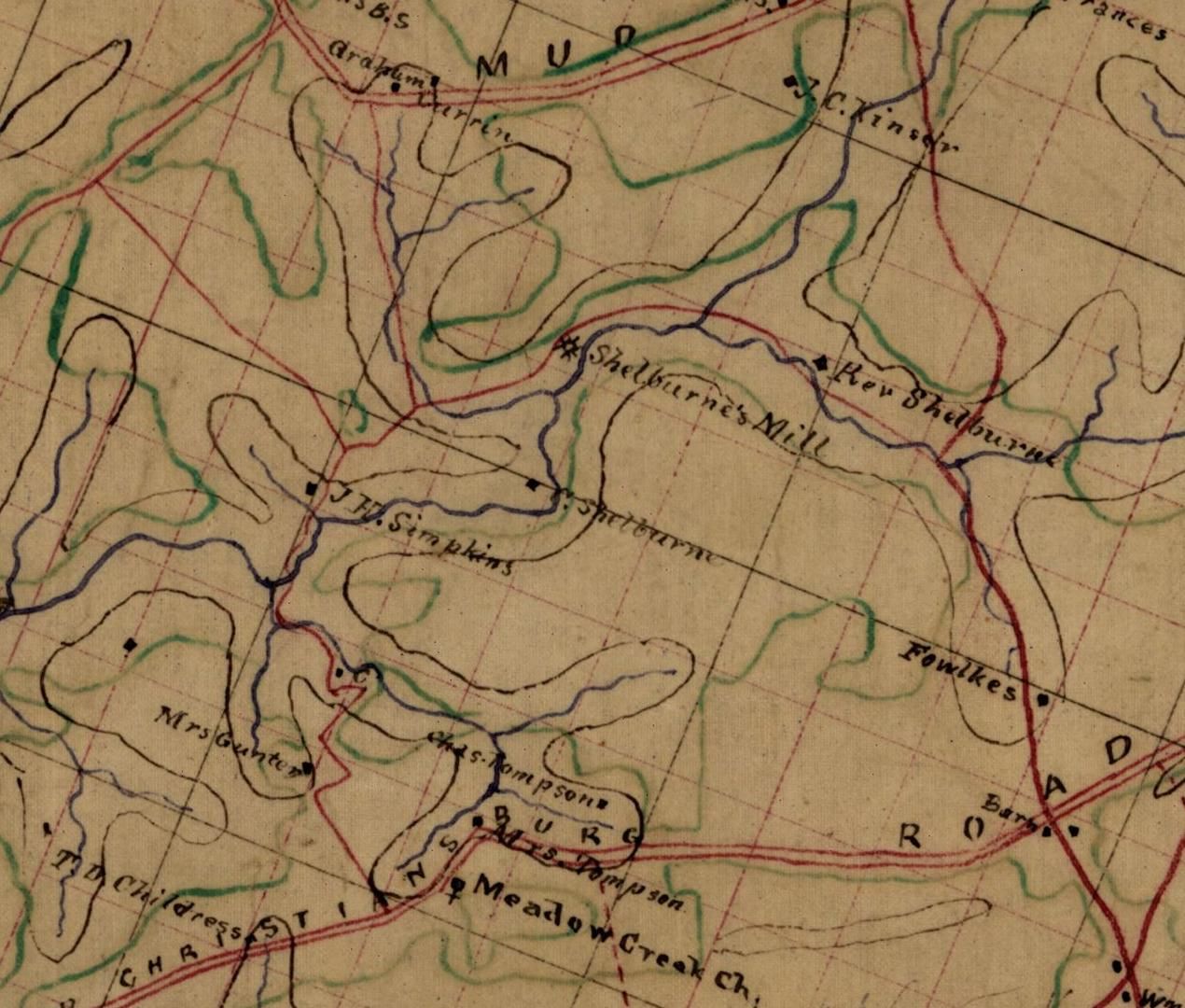 Detail of a hand-drawn 1864 map in brown, red, green and blue ink: blue streams winding through hills, a mill symbol labeled Shelburne’s Mill, and handwritten names including Rev. Shelburne, S. Shelburne, J. H. Simpkins, Mrs. Gunter, Chas. Tompson, Meadow Creek Ch., T. D. Childress, Currin and Mud.