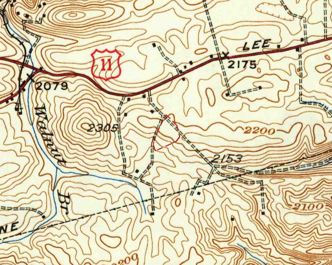 Detail of a 1937 topographic map in brown contour lines: a highway with a U.S. 11 shield and the word Lee across the top, a round knob marked 2305, a stream labeled Walnut Br., farm lanes in double dashed lines, and a small dashed red outline between two of the lanes.