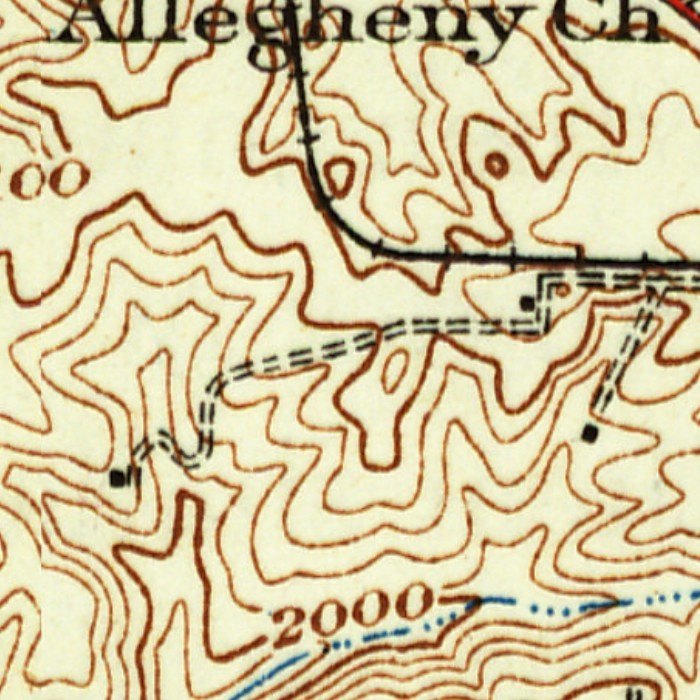 Detail of a 1930s topographic map in brown contour lines: the words Allegheny Ch at the top, a railroad drawn as a black line with cross ties curving down from the top and turning east, a double dashed farm lane winding from the right across the middle to a small black farmhouse square at the left, and a dotted blue stream along the bottom.