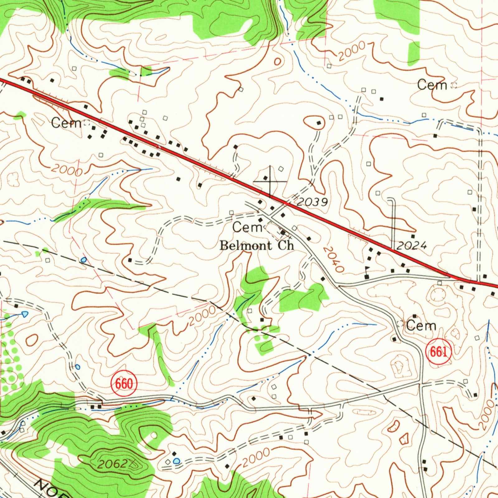Detail of a 1965 topographic map: a red highway running diagonally from upper left to right, small black buildings along it, the labels Cem and Belmont Ch at a road fork right of center, open land with dashed farm lanes to the left of the church, roads marked 660 and 661 below, a railroad labeled Norfolk at lower left and patches of green woods.