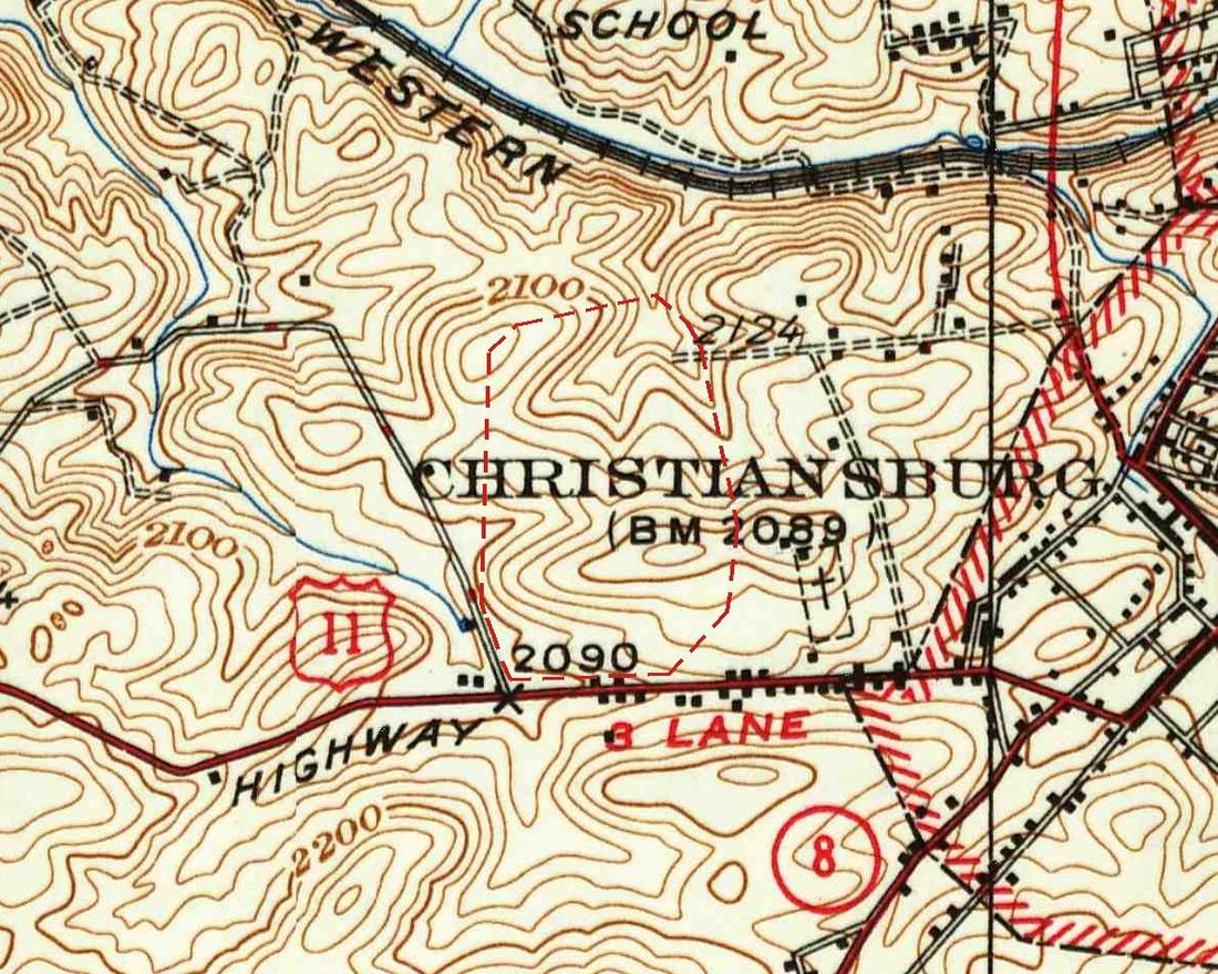 Detail of a 1937 topographic map in brown contour lines: a railroad curving across the top, the word CHRISTIANSBURG printed across open hillside, a large dashed red outline north of a highway marked with a U.S. 11 shield, and the edge of the town grid at right.