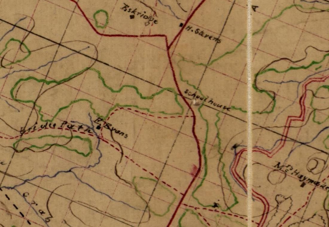 Detail of a hand-drawn 1864 map in brown, red, green and blue ink: a red road running north, a handwritten label reading School house beside it, a dashed red track labeled Bridle Path, and a few house symbols.